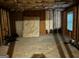 Shows a basement in unfinished condition with bare insulation, concrete floors and exposed ceiling at 10937 Southwood Dr, Hampton, GA 30228