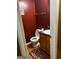 The bathroom features vibrant walls, tile floors, a single sink vanity, and a toilet with paper at 10937 Southwood Dr, Hampton, GA 30228