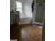 Shows a bathroom featuring a separate shower and soaking tub, vanity with double sinks, and brown floors at 10937 Southwood Dr, Hampton, GA 30228