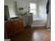 Shows a bathroom featuring a separate shower and soaking tub, vanity with double sinks, and brown floors at 10937 Southwood Dr, Hampton, GA 30228