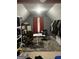 Attic bedroom with gray walls and carpet with desk and ample clothing storage at 10937 Southwood Dr, Hampton, GA 30228