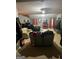 Large bedroom with neutral carpeting, seating area, and unique decor elements at 10937 Southwood Dr, Hampton, GA 30228
