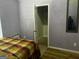 Bedroom with open closet and light purple walls at 10937 Southwood Dr, Hampton, GA 30228