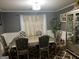Dining room featuring a luxurious table and chairs set at 10937 Southwood Dr, Hampton, GA 30228