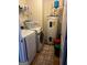 Laundry room with newer machines and water heater at 10937 Southwood Dr, Hampton, GA 30228