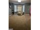 Living room featuring carpet, a bay window, and neutral wall paint at 10937 Southwood Dr, Hampton, GA 30228