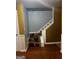 Staircase from the first floor featuring blue and gold walls at 10937 Southwood Dr, Hampton, GA 30228
