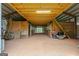 Interior of barn exhibiting horse stalls, dirt floor, and storage in a rustic setting at 228 Indian Creek Rd, Locust Grove, GA 30248
