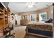 Comfortable bedroom features hardwood floors, natural light, and ample closet space for storage at 228 Indian Creek Rd, Locust Grove, GA 30248