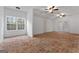 Large bonus room boasting terracotta tile flooring, bright natural light and ceiling fans at 228 Indian Creek Rd, Locust Grove, GA 30248