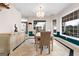 Dining room featuring a chandelier, large windows, with stylish furniture and decor at 228 Indian Creek Rd, Locust Grove, GA 30248