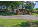 Brick entryway leading to a charming home with a covered porch and well-manicured landscaping at 228 Indian Creek Rd, Locust Grove, GA 30248