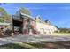 Large outbuilding featuring stone and stucco, garage doors, and a second story deck at 228 Indian Creek Rd, Locust Grove, GA 30248
