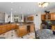 Spacious kitchen with granite countertops, wine rack and island perfect for entertaining and cooking at 228 Indian Creek Rd, Locust Grove, GA 30248