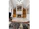Cozy living room featuring a large fireplace with custom bookshelves, and unique leather furniture at 228 Indian Creek Rd, Locust Grove, GA 30248