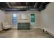Cozy basement features natural light from windows, offering a comfortable retreat at 2673 Deerfield Sw Cir, Marietta, GA 30064