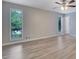 Bright bedroom featuring light-tone walls, fan with lights and natural light from windows at 2673 Deerfield Sw Cir, Marietta, GA 30064