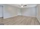 Spacious bedroom with neutral paint, wood-look flooring, modern ceiling fan, and a closet at 2673 Deerfield Sw Cir, Marietta, GA 30064