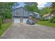 Two-story home showcases a gray exterior, stone accents, two-car garage, and a well-maintained driveway with ample parking at 2673 Deerfield Sw Cir, Marietta, GA 30064