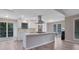 Modern kitchen with a large island, stainless steel appliances, and sleek white cabinetry at 2673 Deerfield Sw Cir, Marietta, GA 30064