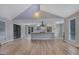Open-concept living room and kitchen featuring vaulted ceilings and an island with seating at 2673 Deerfield Sw Cir, Marietta, GA 30064