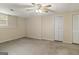 This bedroom features neutral decor and plenty of closet space for storage solutions at 1118 Sequoia Trl, Mcdonough, GA 30252