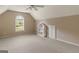 Carpeted bedroom features a ceiling fan, a window and a dollhouse at 1118 Sequoia Trl, Mcdonough, GA 30252
