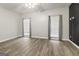 Spacious bedroom with hardwood floors and two large windows providing plenty of natural light at 1118 Sequoia Trl, Mcdonough, GA 30252