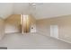Large carpeted bonus room with neutral paint and ceiling fan at 1118 Sequoia Trl, Mcdonough, GA 30252