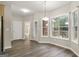 Bright dining room with outdoor view and easy access to kitchen and living spaces at 1118 Sequoia Trl, Mcdonough, GA 30252