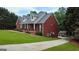 Beautiful home featuring a brick exterior, covered porch and manicured lawn at 1118 Sequoia Trl, Mcdonough, GA 30252