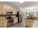 Well-equipped kitchen features stainless steel appliances and granite countertops at 1118 Sequoia Trl, Mcdonough, GA 30252