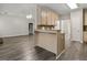 Open-concept kitchen with breakfast bar, granite countertops, and modern fixtures at 1118 Sequoia Trl, Mcdonough, GA 30252