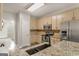 Stylish kitchen featuring granite counters, stainless steel appliances, and modern updates at 1118 Sequoia Trl, Mcdonough, GA 30252