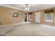 Spacious living room features a ceiling fan and neutral decor, ready for personalization at 1118 Sequoia Trl, Mcdonough, GA 30252