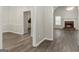 An open floor plan showcasing wood floors connecting the living room to other areas at 1118 Sequoia Trl, Mcdonough, GA 30252