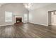 The living room is complete with a brick fireplace and vaulted ceiling, providing a cozy space at 1118 Sequoia Trl, Mcdonough, GA 30252