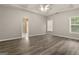 Spacious main bedroom with hardwood floors, tray ceiling and natural light at 1118 Sequoia Trl, Mcdonough, GA 30252