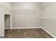 A very spacious walk-in closet with wire shelving and hardwood floors at 1118 Sequoia Trl, Mcdonough, GA 30252