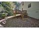 Backyard with small wooden deck at 2066 Tidwell Trl, Stone Mountain, GA 30088