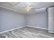 Basement with a ceiling fan and gray vinyl flooring at 2066 Tidwell Trl, Stone Mountain, GA 30088