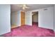 Empty room featuring plush carpet, an AC vent, and doorway access at 2066 Tidwell Trl, Stone Mountain, GA 30088