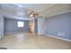 Bright bedroom featuring a ceiling fan, closet and hard wood floors at 2066 Tidwell Trl, Stone Mountain, GA 30088