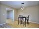 Dining area showcases modern pendant lighting and barstool seating next to a doorway at 2066 Tidwell Trl, Stone Mountain, GA 30088