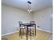 Dining area with modern pendant lighting and bar stool seating that compliments the light-toned flooring at 2066 Tidwell Trl, Stone Mountain, GA 30088