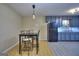 Eat-in kitchen is steps away from the gray cabinets, stainless steel appliances, and modern lighting at 2066 Tidwell Trl, Stone Mountain, GA 30088