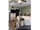 Bedroom showing dresser, open closet and tv in a cozy space at 1137 Eagles Nest Cir, Carrollton, GA 30116