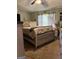Comfortable bedroom features a bed, nightstand and light neutral colors at 1137 Eagles Nest Cir, Carrollton, GA 30116