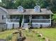 Charming house with a quaint front yard and a cozy covered porch at 1137 Eagles Nest Cir, Carrollton, GA 30116