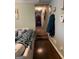 Hallway leading to additional rooms with hardwood floors and neutral decor at 1137 Eagles Nest Cir, Carrollton, GA 30116
